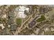Aerial view of community amenities, including tennis courts, swimming pools, and buildings, creating a vibrant lifestyle at 40215 N 110Th Pl, Scottsdale, AZ 85262