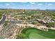Aerial view showcasing the surrounding golf course and desert community at 40215 N 110Th Pl, Scottsdale, AZ 85262