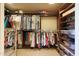 Spacious walk-in closet with custom shelving and ample storage for clothing and accessories at 40215 N 110Th Pl, Scottsdale, AZ 85262