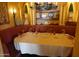 Cozy dining area with yellow walls and a corner booth at 40215 N 110Th Pl, Scottsdale, AZ 85262