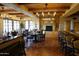 Restaurant style dining area featuring a tile fireplace and wood beams at 40215 N 110Th Pl, Scottsdale, AZ 85262