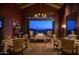 Elegant dining room with long table, patterned rug, and an amazing night view at 40215 N 110Th Pl, Scottsdale, AZ 85262