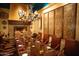 Elegant dining room with long wooden table and chandelier at 40215 N 110Th Pl, Scottsdale, AZ 85262