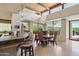Dining room area with wood-beamed ceilings and large windows, perfect for gatherings at 40215 N 110Th Pl, Scottsdale, AZ 85262