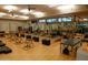 Large fitness center is well-equipped with modern machines and natural light for a complete workout experience at 40215 N 110Th Pl, Scottsdale, AZ 85262