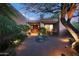 Charming front entrance with desert landscaping, lighting, and a stone walkway, creating a welcoming ambiance at 40215 N 110Th Pl, Scottsdale, AZ 85262