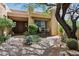 Inviting front entrance featuring a private courtyard, desert landscaping, and unique architecture at 40215 N 110Th Pl, Scottsdale, AZ 85262