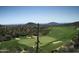 Scenic golf course view showcasing lush green fairways and desert landscape with mountain views at 40215 N 110Th Pl, Scottsdale, AZ 85262