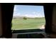 Scenic golf course view from indoors at 40215 N 110Th Pl, Scottsdale, AZ 85262