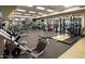 A modern gym filled with weightlifting machines, free weights, and televisions in an open, well-lit space at 40215 N 110Th Pl, Scottsdale, AZ 85262