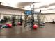 A spacious gym featuring a wide variety of equipment including free weights, and fitness accessories at 40215 N 110Th Pl, Scottsdale, AZ 85262