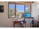 Window view from home office, providing natural light and a view of the desert landscape at 40215 N 110Th Pl, Scottsdale, AZ 85262