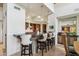 Gourmet kitchen features a breakfast bar with pendant lighting and seating for four at 40215 N 110Th Pl, Scottsdale, AZ 85262