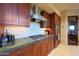 Gourmet kitchen with custom wood cabinets, granite countertops, and high-end stainless steel appliances at 40215 N 110Th Pl, Scottsdale, AZ 85262