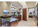 Charming kitchen featuring natural light, granite counters, wood cabinetry and stainless appliances at 40215 N 110Th Pl, Scottsdale, AZ 85262