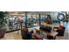 Elegant lounge area featuring comfortable seating, stylish decor, and views into an adjacent gym at 40215 N 110Th Pl, Scottsdale, AZ 85262
