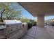 Outdoor kitchen with a stainless steel grill and counter space, perfect for entertaining and enjoying the outdoors at 40215 N 110Th Pl, Scottsdale, AZ 85262
