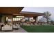 An outdoor lounge area provides residents comfortable seating to relax or watch a golf match at 40215 N 110Th Pl, Scottsdale, AZ 85262