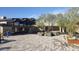 Stylish outdoor patio featuring modern furniture, desert landscaping, and a serene water feature, perfect for relaxation at 40215 N 110Th Pl, Scottsdale, AZ 85262