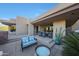 Inviting outdoor patio with comfortable seating, a dining area, and scenic desert views at 40215 N 110Th Pl, Scottsdale, AZ 85262