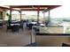 Inviting outdoor seating area with dark wicker furniture and open views of the surrounding landscape at 40215 N 110Th Pl, Scottsdale, AZ 85262
