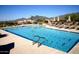 Community pool with lounge chairs overlooking mountain views in Desert Mountain at 40215 N 110Th Pl, Scottsdale, AZ 85262
