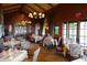 Large restaurant-style dining area with numerous tables and decorative vases at 40215 N 110Th Pl, Scottsdale, AZ 85262