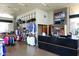 Bright retail store with apparel, golf bags, a modern checkout counter, and a TV, providing a convenient shopping experience at 40215 N 110Th Pl, Scottsdale, AZ 85262