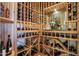 This extensive wine cellar features custom wood racking and display shelving at 40215 N 110Th Pl, Scottsdale, AZ 85262