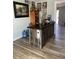 Charming home bar with wood accents and a sleek countertop, ideal for entertaining at 4123 N 106Th N Ave, Phoenix, AZ 85037