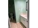 Cozy bathroom featuring a vanity with white cabinets and a framed mirror at 4123 N 106Th N Ave, Phoenix, AZ 85037