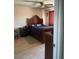 Comfortable bedroom with a bed, nightstand, and natural light at 4123 N 106Th N Ave, Phoenix, AZ 85037