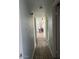 Inviting hallway with wood-look flooring and neutral wall paint at 4123 N 106Th N Ave, Phoenix, AZ 85037