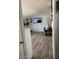 Open-concept living room featuring modern flooring and a large-screen TV at 4123 N 106Th N Ave, Phoenix, AZ 85037