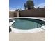 Inviting pool with cool water, a tanning ledge, and easy access with a built-in metal pool ladder at 4123 N 106Th N Ave, Phoenix, AZ 85037