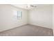 Bedroom with a ceiling fan and a view of the outdoors through the window at 4149 E Devon Dr, Gilbert, AZ 85296