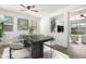 Dining room with a dark marble table, seating for eight, and views of the staircase at 4149 E Devon Dr, Gilbert, AZ 85296