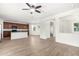 Open-concept space with kitchen view and dark cabinets, perfect for modern living and entertaining at 4149 E Devon Dr, Gilbert, AZ 85296