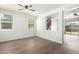 Bright, airy living room boasts wood-look floors and a view of the staircase, creating an inviting space at 4149 E Devon Dr, Gilbert, AZ 85296
