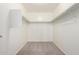 Spacious walk-in closet with ample storage space and neutral carpeting at 4149 E Devon Dr, Gilbert, AZ 85296