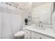 Bathroom featuring a shower with white curtain, a toilet, and a vanity with a white countertop at 42505 W Venture Rd, Maricopa, AZ 85138