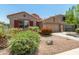Attractive single-Gathering home featuring desert landscaping, with a two-car garage and well-maintained yard at 42505 W Venture Rd, Maricopa, AZ 85138