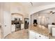 Modern kitchen with stainless steel appliances, granite counters, tile backsplash, and an open layout at 42505 W Venture Rd, Maricopa, AZ 85138