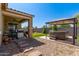 Outdoor living: covered patio, built-in grill, stepping stones, and a gazebo-covered hot tub at 5612 N 109Th Ave, Phoenix, AZ 85037