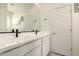 Modern bathroom featuring dual sinks with white cabinets and black hardware at 5612 N 109Th Ave, Phoenix, AZ 85037