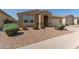 Single-story home with a red tile roof, desert landscaping, and an attached two-car garage at 5612 N 109Th Ave, Phoenix, AZ 85037