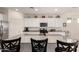 Bright kitchen featuring white cabinets, stainless steel appliances, and a granite island at 5612 N 109Th Ave, Phoenix, AZ 85037