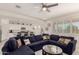 Spacious living room with a plush sectional sofa, open to kitchen and dining area at 5612 N 109Th Ave, Phoenix, AZ 85037
