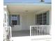 Cozy front porch with seating area, featuring a secure front door, and window shutters for added appeal at 5808 E Lockwood St, Mesa, AZ 85215