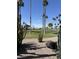 Picturesque view of the pristine golf course, accentuated by towering palm trees and desert landscaping at 5808 E Lockwood St, Mesa, AZ 85215